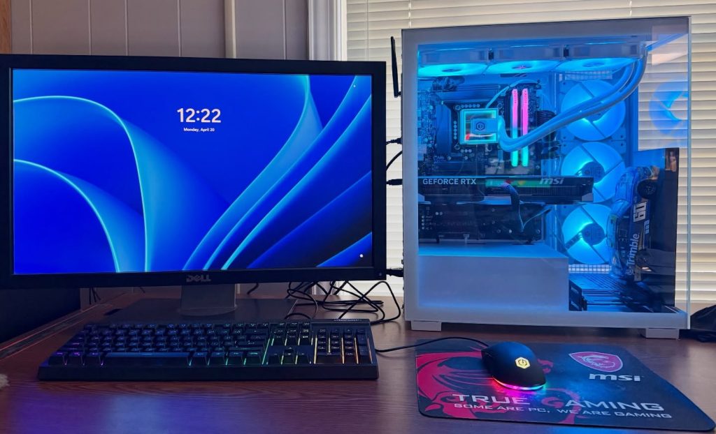 Desktop scanning workstation with monitor, keyboard and a glowing liquid-cooled PC tower
